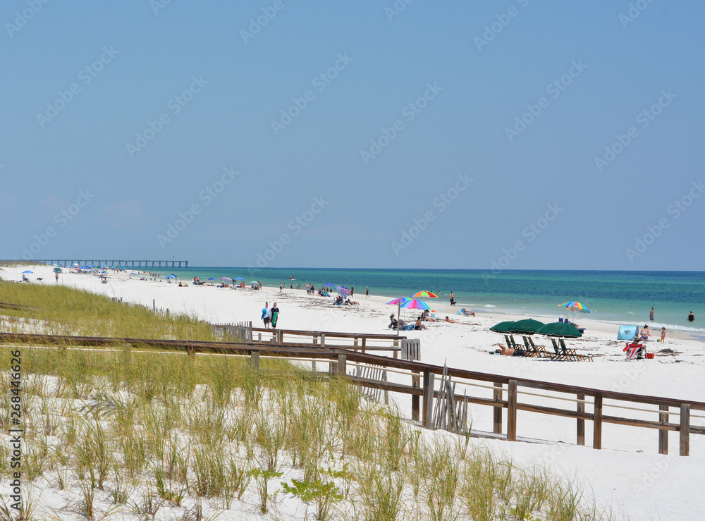 Fototapeta premium Beach goers at Pensacola Beach in Escambia County, Florida on the Gulf of Mexico, USA