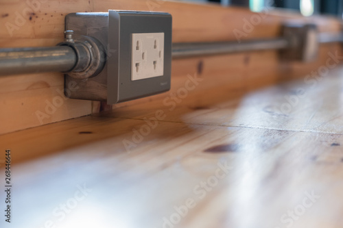 Receptacle made of metal, attached to a wooden surface Modern layout Like in a restaurant or coffee shop