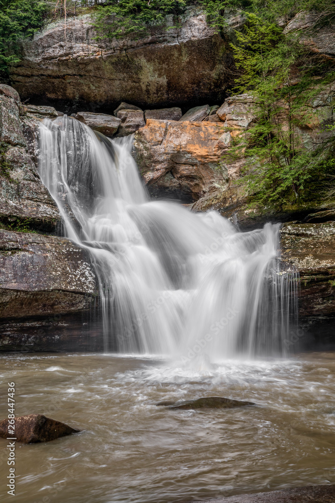 Fototapeta premium Cedar Falls Overflow - Cedar Falls, a beautiful waterfall in the Hocking Hills of Ohio, flows full after heavy spring rains.