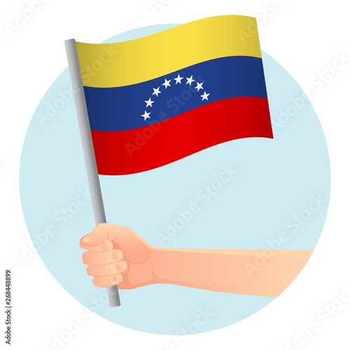 venezuela flag in hand