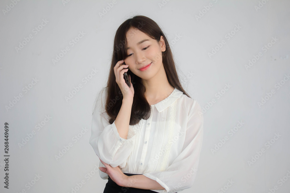 portrait of thai china adult office girl white shirt walk and calling smart phone portrait of thai china adult office girl white shirt walk and calling smart phone