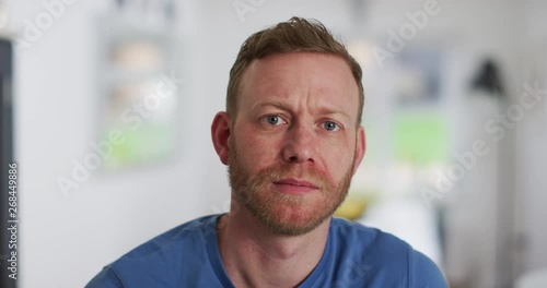 4K Close up of serious and unhappy man looking intently at camera