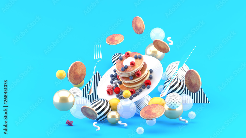 Pancakes and berries among colorful balls on a blue background.-3d rendering. Pancakes and berries among colorful balls on a blue background.-3d rendering.