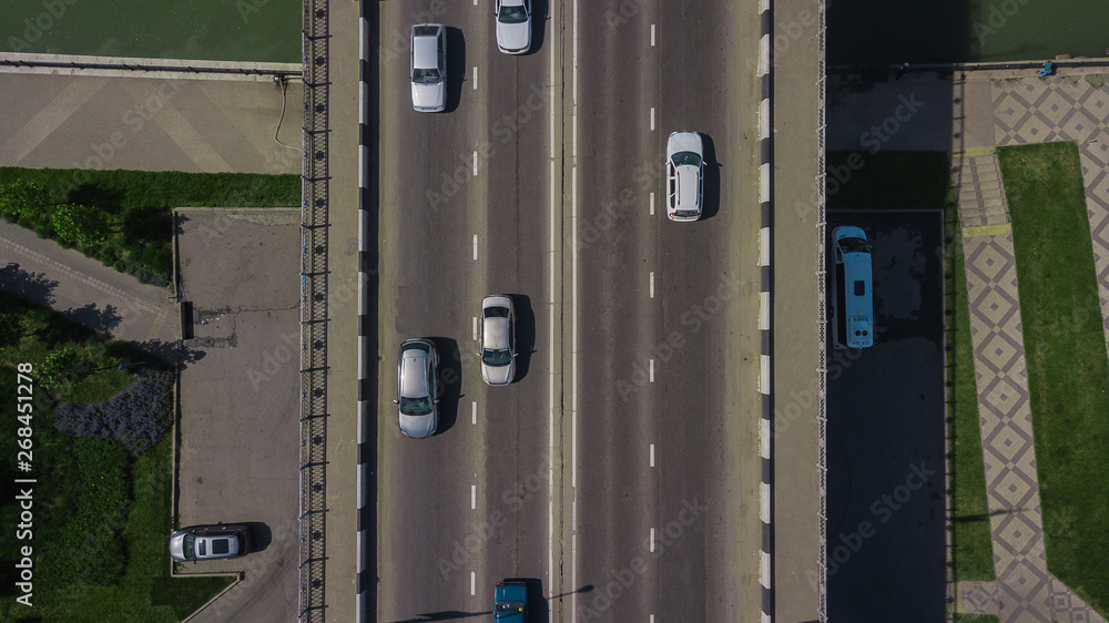 Drone's Eye View - Top down view from above of urban traffic jam with cars and truck on bridge Drone's Eye View - Top down view from above of urban traffic jam with cars and truck on bridge