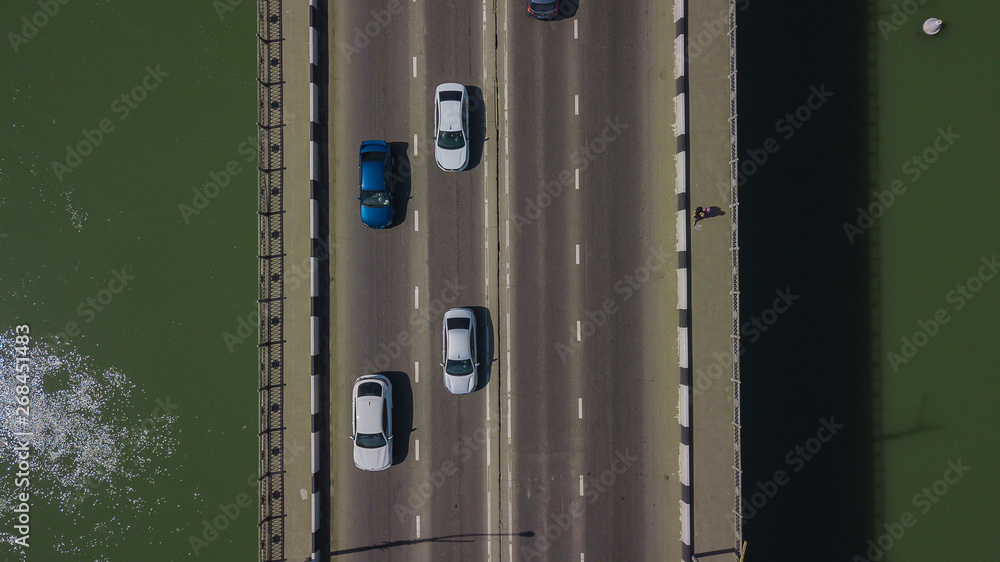 Fototapeta premium Drone's Eye View - Aerial top down view of urban traffic jam on bridge