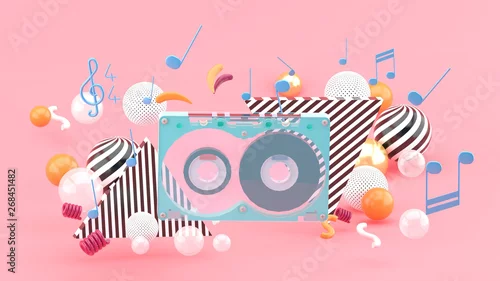Obraz Taśma muzyczna wśród kolorowych piłek na różowym tle. - 3d rendering.