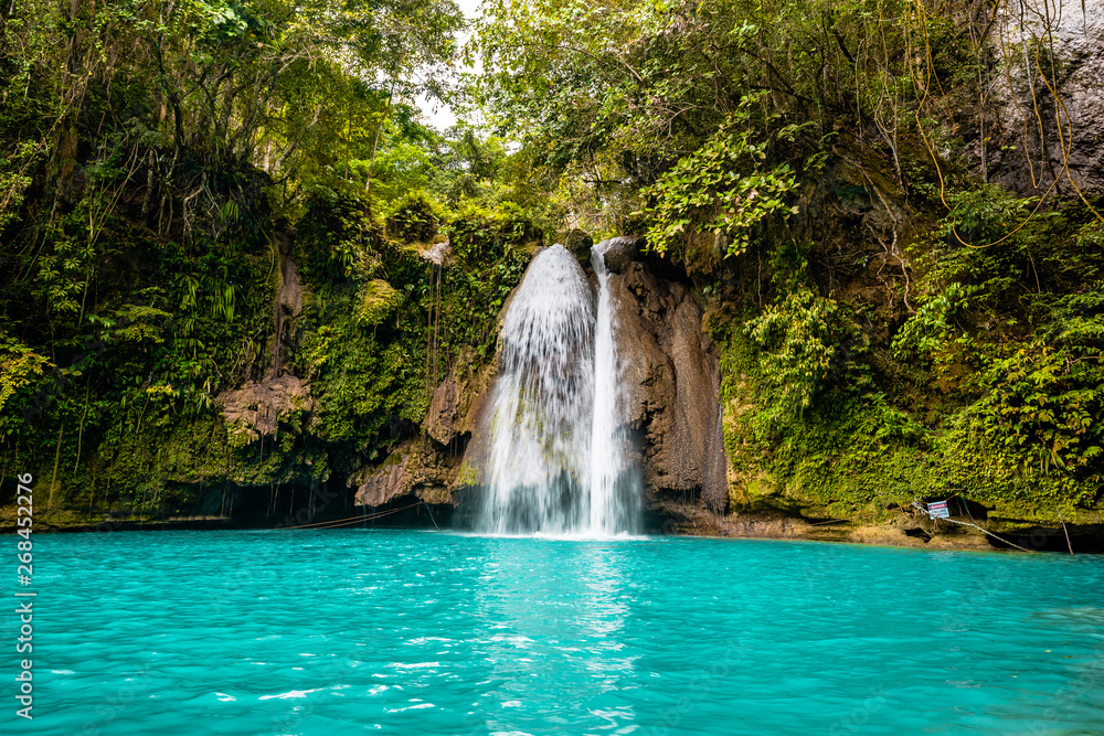 Kawasan Falls on Cebu island in Philippines, turquoise waterfalls Kawasan Falls on Cebu island in Philippines, turquoise waterfalls