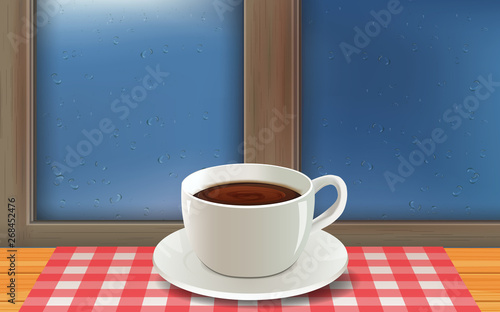 hot coffee cup on the wooden table at the glass windows in the rainday