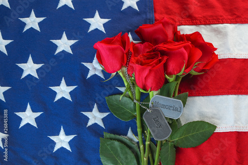 Fototapeta Naklejka Na Ścianę i Meble -  American flag with roses and military dog tags