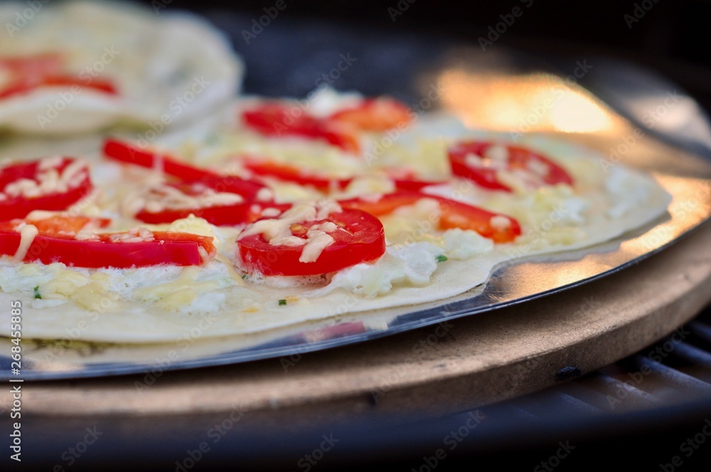 detail of fresh and delicious tarte Alsatian with cheese and paprika tomato grilled detail of fresh and delicious tarte Alsatian with cheese and paprika tomato grilled