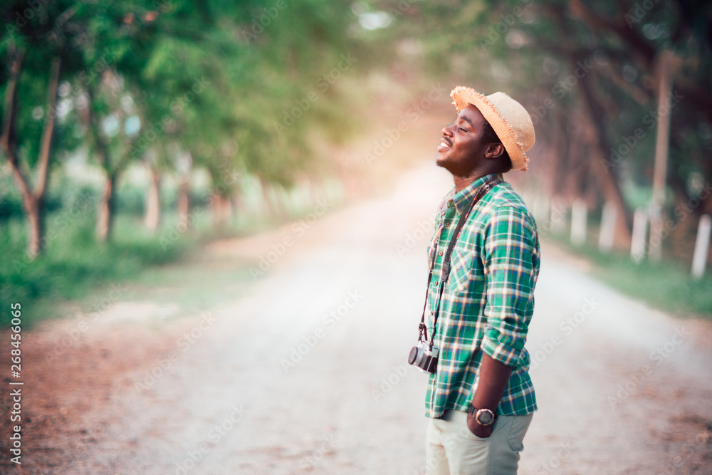 African man traveler stand to close eyes with relax and happy African man traveler stand to close eyes with relax and happy