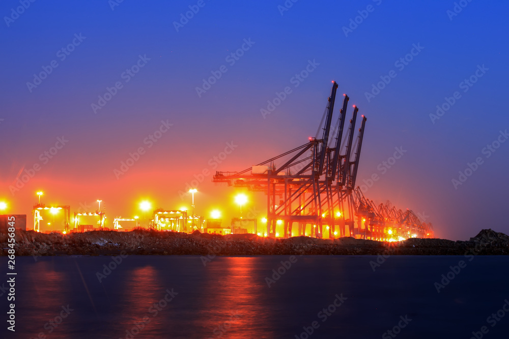Cranes at the cargo terminal in the evening