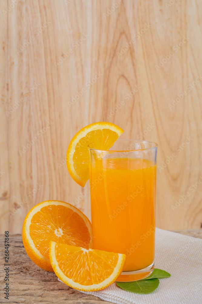 Glass of orange juice placed on wood. Glass of orange juice placed on wood.