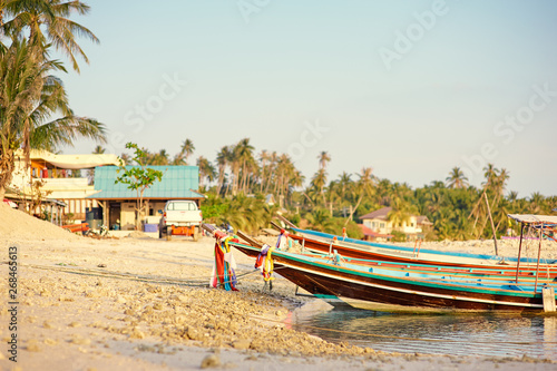 Travel by Thailand. Landscape with traditional longtail fishing boat on the sea beach. © luengo_ua
