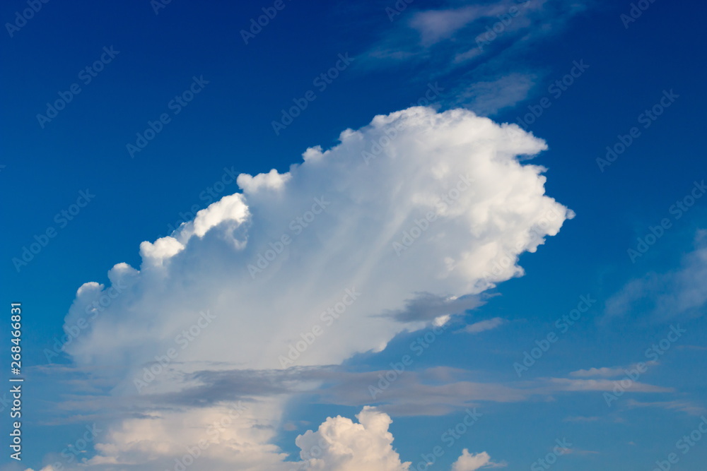 Αυτοκόλλητο Amazing white cloud like a dirigible on a background of saturated blue sky
