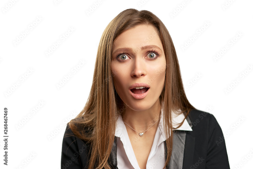 Wow! Shock! Amazed young business woman in black suit. Isolated on white. Wow! Shock! Amazed young business woman in black suit. Isolated on white.