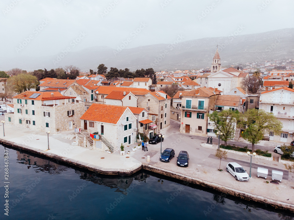 Obraz premium Drone shot of the Kastel old town on the coast of Dalmatia,Croatia . A famous tourist destination on the Adriatic sea.