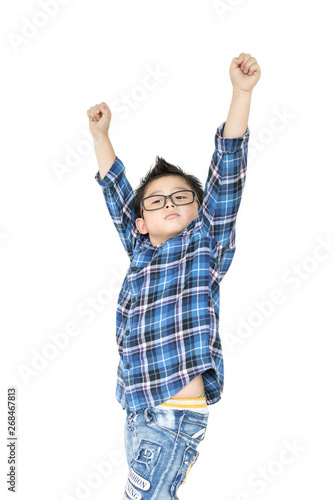 Little boy in glasses raise hands up on white background on isolated