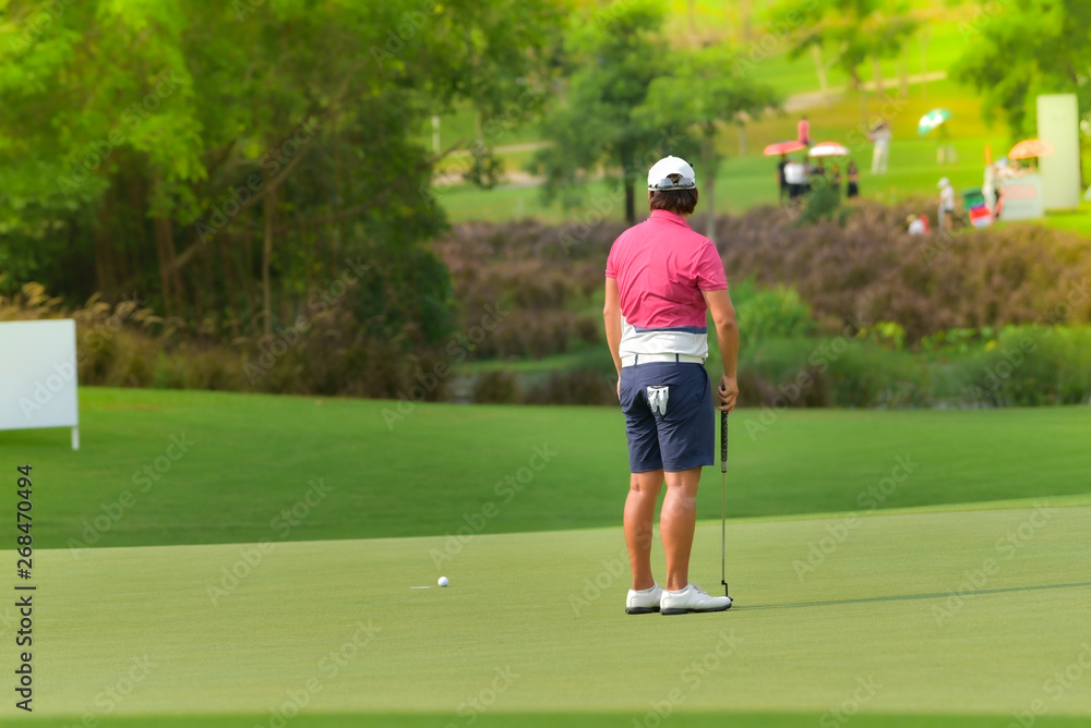 Golfers are looking for a putt. Golfers are looking for a putt.