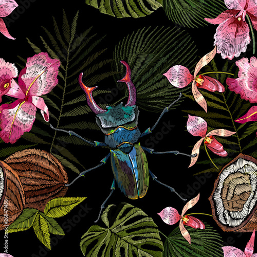 Embroidery beetle deer, palm leaves and orchid flowers seamless pattern. Jungle art.  Summer tropical template for clothes, textiles, t-shirt design