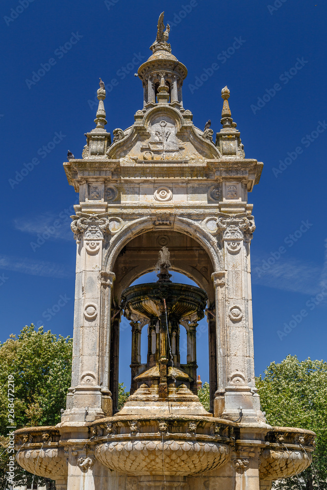 Old baroque fountain on the square in the historic town of Chateaudun, France