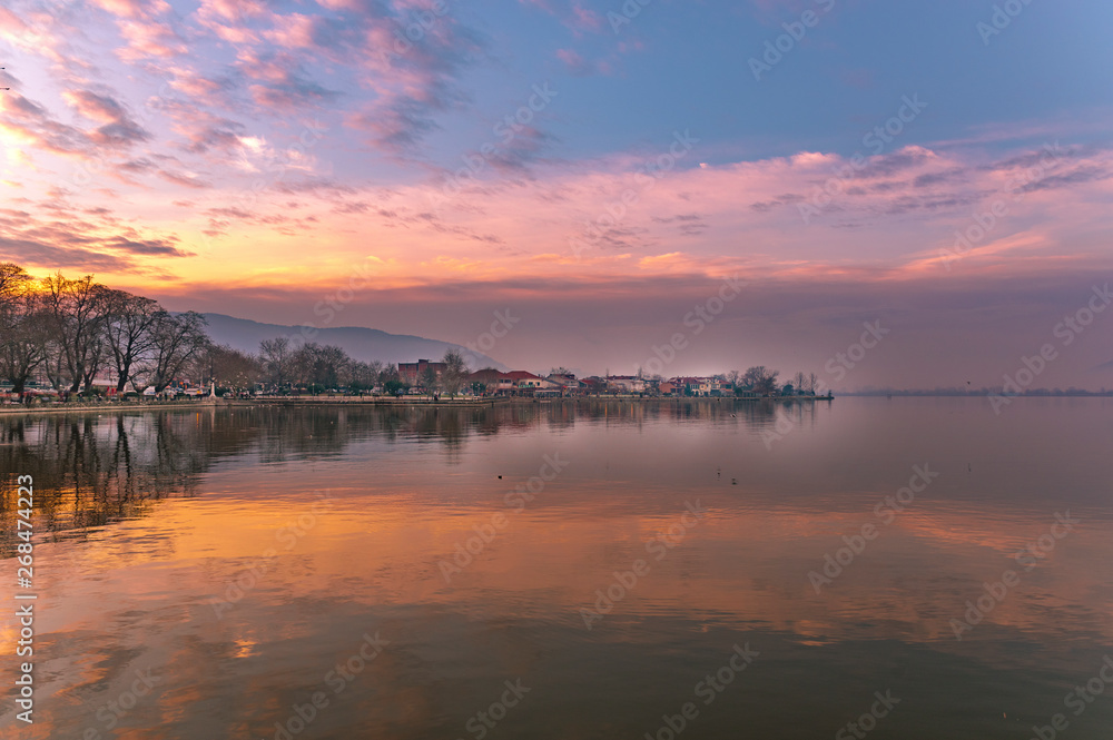 view of Ioannina city nad lake at sunset
