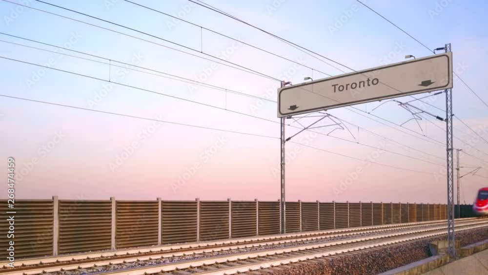 toronto train station signboard,train travels under railway billboard toronto train station signboard,train travels under railway billboard