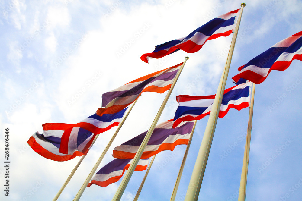 Waving flag of Thailand. Group of flag poles. Flags blowing upright in the wind.  Concept for nation and country.