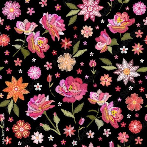 Embroidery seamless pattern with beautiful flowers. Floral print for fabric and textile. Vector embroidered illustration.