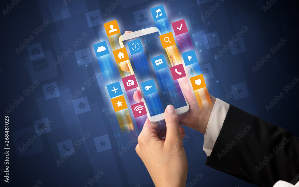 Female hand using smartphone with colorful angular fast switching application icons around Female hand using smartphone with colorful angular fast switching application icons around
