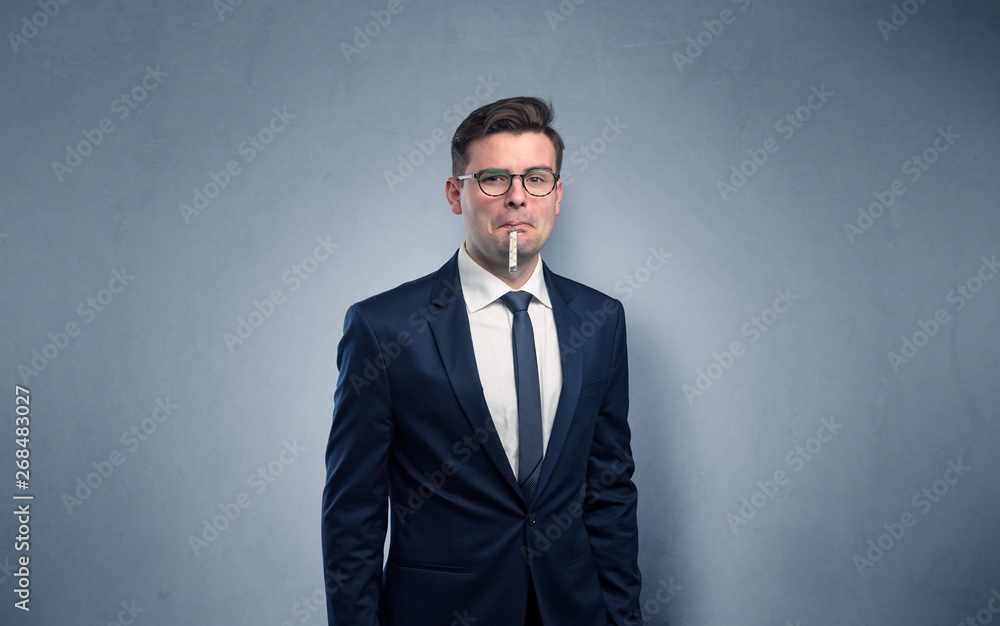 Young tired businessman with thermometer and copy space
Young tired businessman with thermometer and copy space