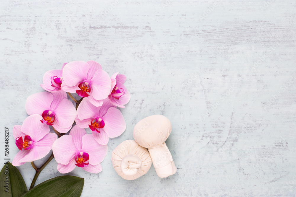 Sea salt, aromatherapy oil in bottles and orchid on vintage wooden background. Sea salt, aromatherapy oil in bottles and orchid on vintage wooden background.