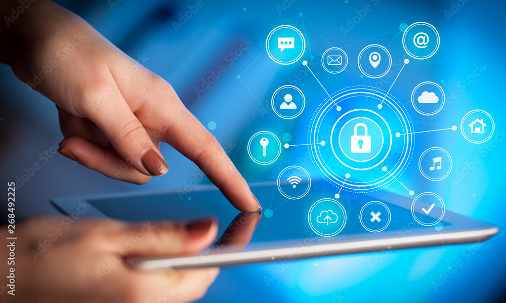 Hand holding tablet with online security concept
Hand holding tablet with online security concept