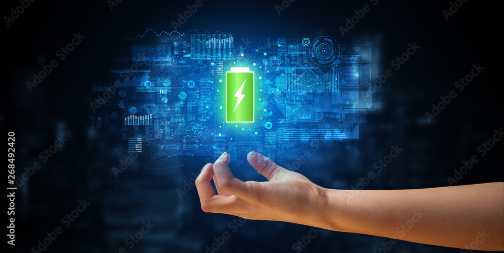 Elegant hand holding battery with full of energy
Elegant hand holding battery with full of energy