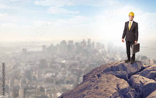 Young business person looking to the city from distance 