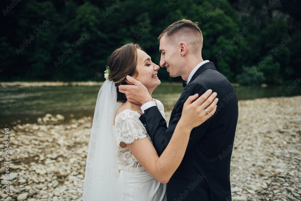 Happy romantic young couple celebrating their marriage. Happy romantic young couple celebrating their marriage.