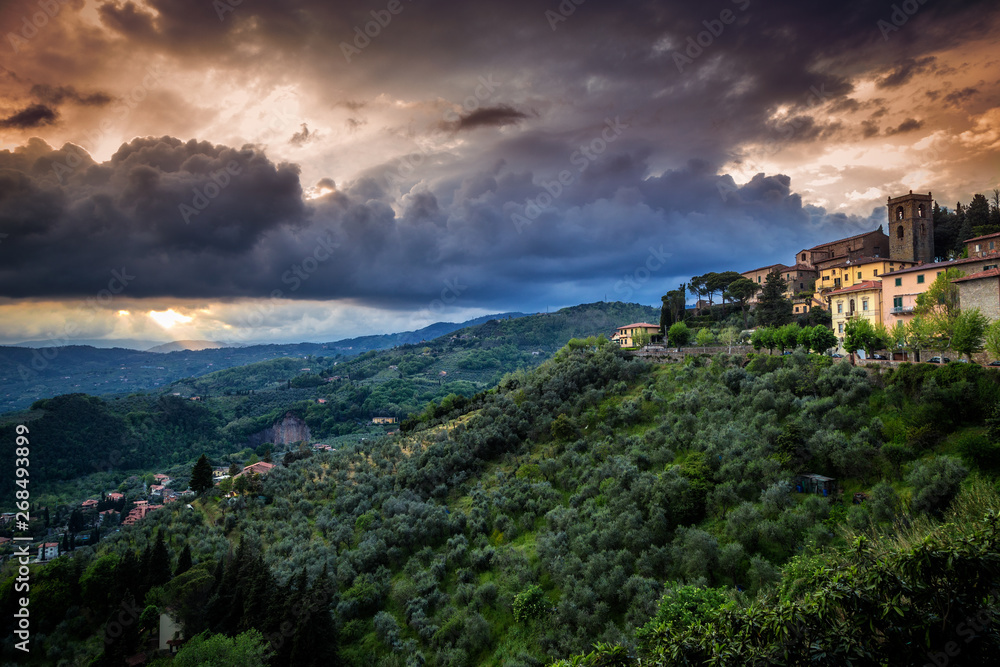 Montecatini Alto - medieval village above Montecatini Terme town with surrounding landscape at sunset in Tuscany, Italy, Europe.