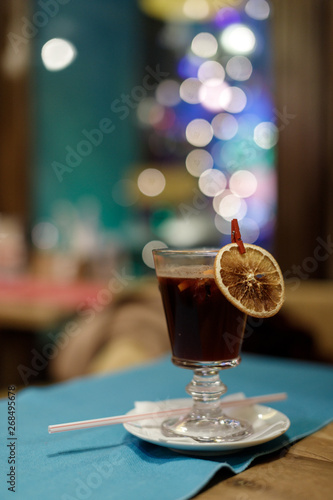 Hot mulled wine decorated with dry orange
