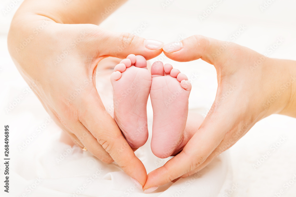 Newborn Baby Feet in Mother Hands Heart, Mom and New Born Kid Foot, Love and Health Care