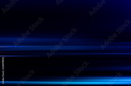 digitally generated image of blue light and stripes moving fast over black background