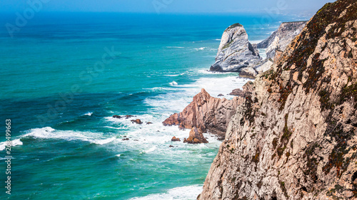 Summer on the ocean high cliffs blue green waters