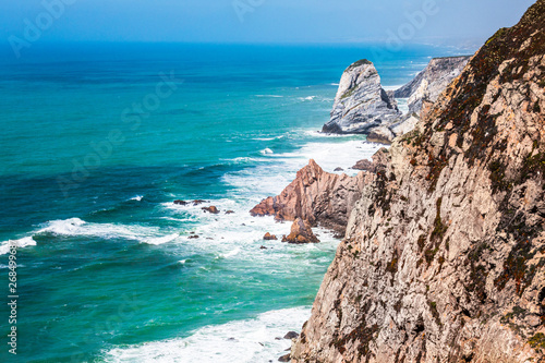 Summer on the ocean high cliffs blue green waters