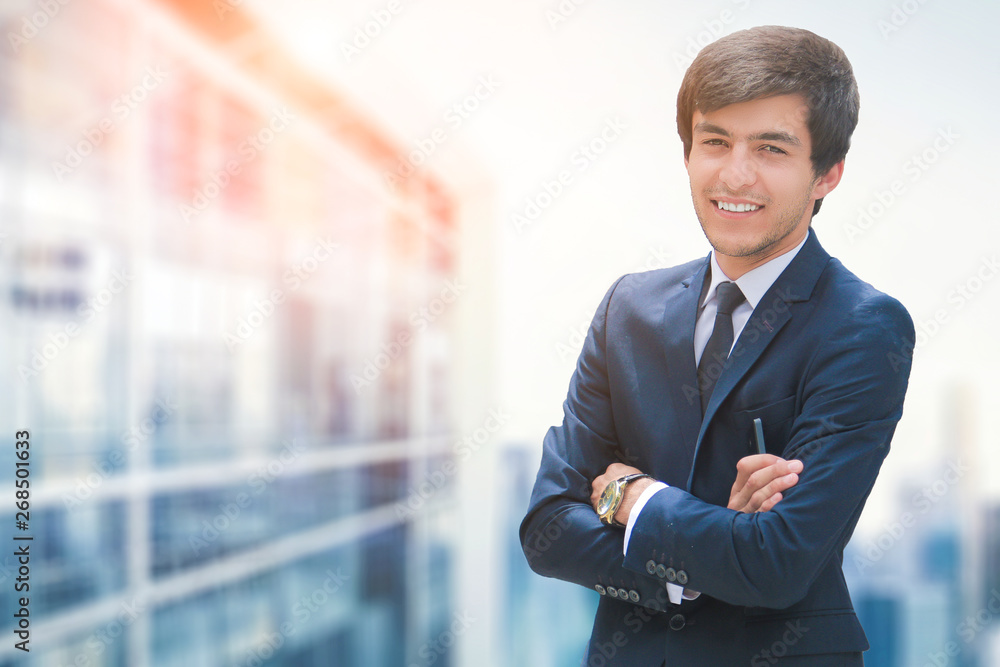 Businessman smiling standing near the business center Businessman smiling standing near the business center