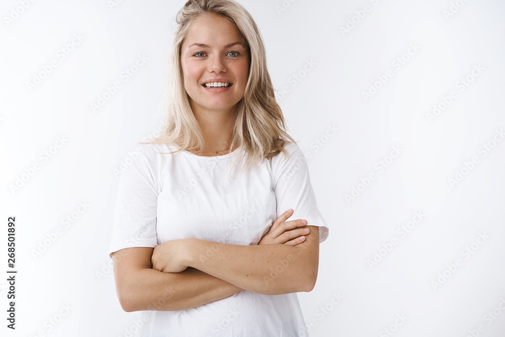 Healthy and happy female dietologyst wanna share secrets active positive lifestyle posing in white t-shirt crossed arms over chest smiling delighted confident at camera being friendly over white wall Healthy and happy female dietologyst wanna share secrets active positive lifestyle posing in white t-shirt crossed arms over chest smiling delighted confident at camera being friendly over white wall
