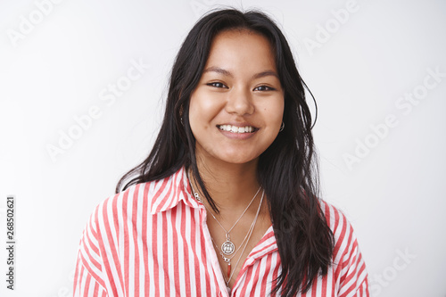 Photos Close-up shot of upbeat outgoing attractive vietnamese woman in striped blouse l