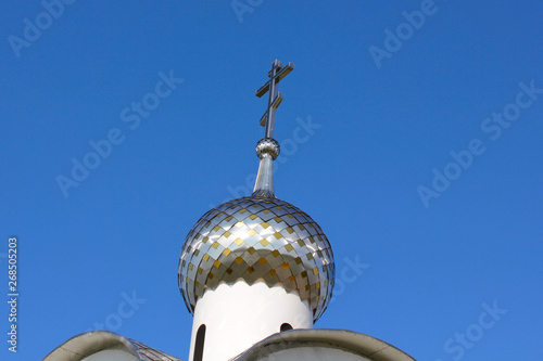 dome of the chapel with a cross against the blue sky