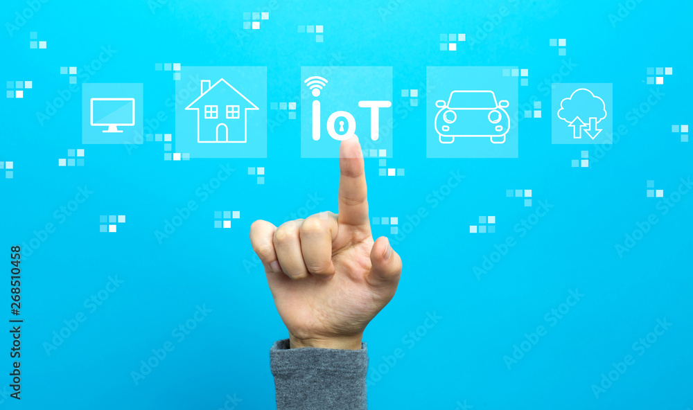 IoT theme with hand on a blue background IoT theme with hand on a blue background
