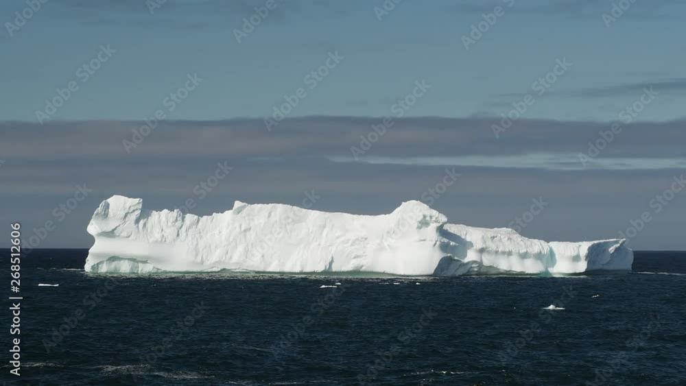An iceberg along the Newfoundland coastline in summer, very popular with tourist. An iceberg along the Newfoundland coastline in summer, very popular with tourist.