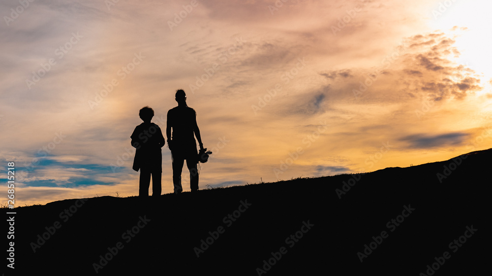 silhouette of mother and son at sunset in Galle Fort