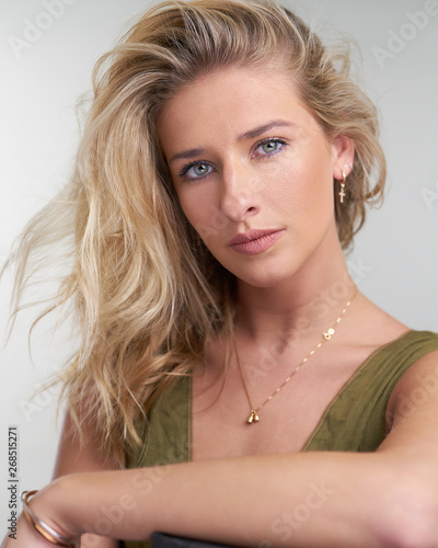 Portrait of young blond girl fair skin white background studio